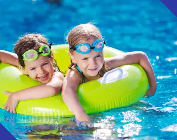 Kids enjoying a clean backyard swimming pool